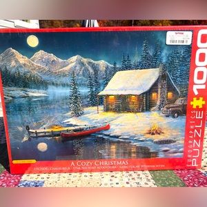 New. Sealed. Euro graphics “A Cozy Christmas” 1000 piece puzzle.
